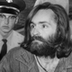 Charles Manson being escorted to court for a preliminary hearing on Dec. 3, 1969, in Los Angeles. (John Malmin/Getty Images)